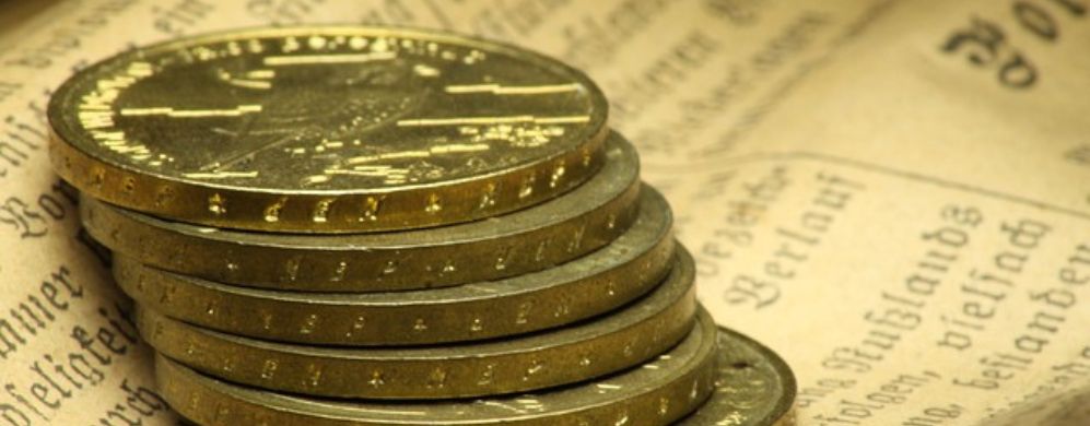 pila di monete d'oro.Aurum24